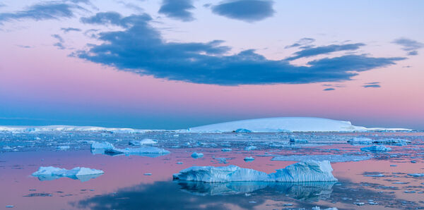 Sunset over Antarctic landscape